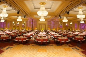 Blue Spark Event Design - Orange dazzle linen, brown chivari, centerpieces, large ballroom