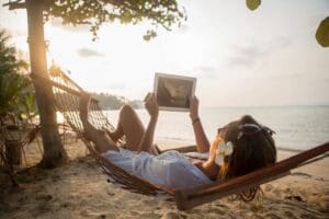 Photo of woman in a hammock on a beach