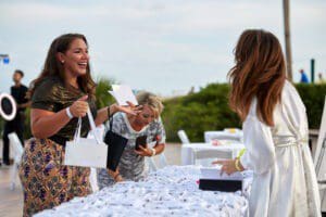 Photo of fall launch event, give bag table