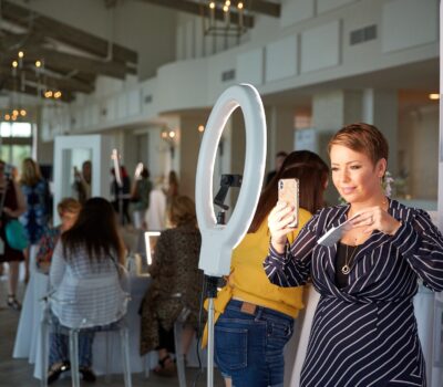 Photo of Fall launch event, woman talking about the products on social media