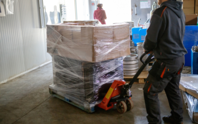 Photo of person moving boxes on pallet jack